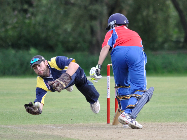 Jamie Kerr takes a diving catch to dismiss Craig.jpg